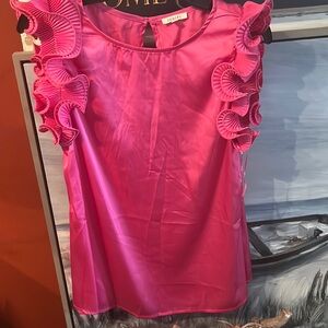 Polyester new ruffle too. New and never worn size m